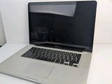 an apple macbook pro laptop computer sitting on top of a white table