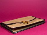 an image of a wallet on a pink background