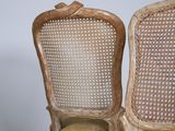 pair of antique french cane back chairs with yellow cushions