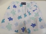 a close up of a white shorts with blue turtles on it