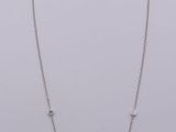 silver plated necklace with a square shaped pendant and a chain with beads
