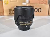 a camera lens sitting on a table next to a box