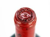 a close up of a bottle of wine on a table