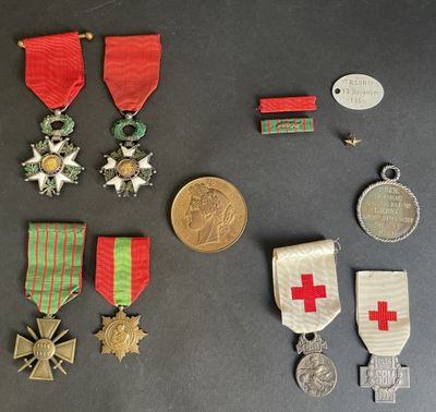 several medals and medals are displayed on a black surface