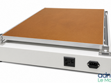 a white box with a brown cover sitting on top of it