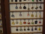 a picture of a display case filled with many different types of earrings