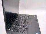 a laptop with a black keyboard on a white surface