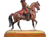 figurine of a man on a horse with a red hat