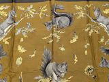 an image of a yellow table cloth with squirrels on it