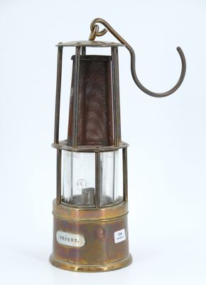 an old fashioned lantern with a hook on a white background