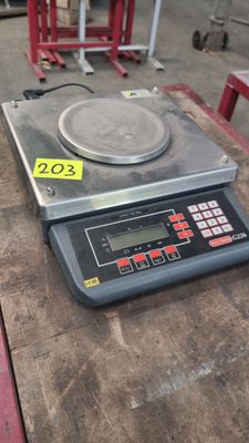 an image of a scale sitting on a table in a warehouse
