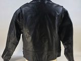 the back of a black leather jacket on a mannequin head