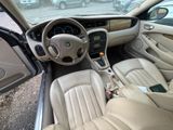 beige interior of a car with beige leather seats and a steering wheel