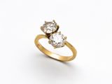 a close up of a diamond ring on a white background
