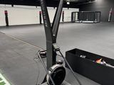 an empty indoor gym with a football field and a football goal