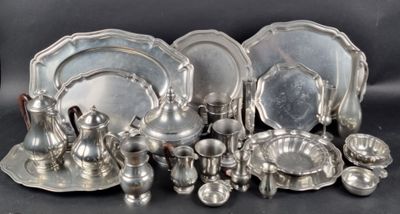 many pieces of silver on the table together