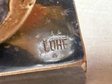 a close up of a clock with a clock face on it ' s side