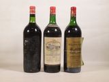 trois bouteilles de vin sont alignées sur une surface blanche