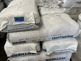 several bags of cement stacked on top of each other in a warehouse