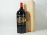 a bottle of wine sitting next to a wooden box