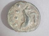 an old coin with a bird on it sitting on top of a table