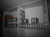 a picture of a shelf with boxes on it in a room