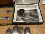 a lot of silverware in a box on a table