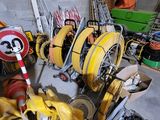 a lot of different types of construction equipment in this garage