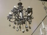 a chandelier hanging from the ceiling in a store