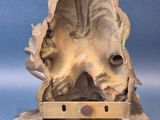 a statue of a cat that is sitting on a table