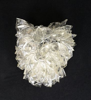 a close up of a glass sculpture on a black surface
