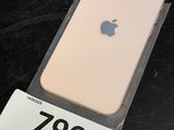 a close up of an iphone with a price tag on a table