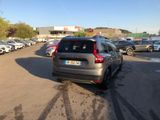 many cars parked in a parking lot in a parking lot