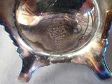 a silver bowl that is sitting on a table