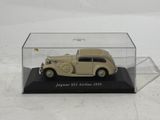 a small model of a car in a glass case