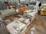 many bags of food inside of a large greenhouse