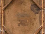 an old wooden box with a piece of paper taped around it