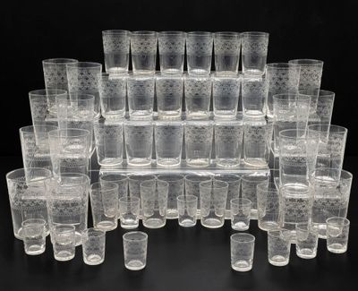 a lot of glasses that are sitting on a table