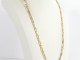 a close up of a mannequin with a gold chain on it