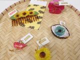 a lot of hair accessories that are on a tray