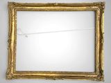 an old gold picture frame with a string attached to it