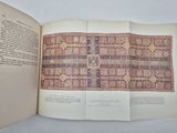an open book with a picture of a rug on it