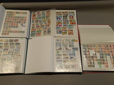 a lot of stamps in a book on a table