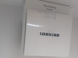 a picture of a box of liebberr powder sitting on a wall