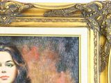 a painting of a woman with long hair in a gold frame