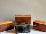 three small wooden boxes sitting next to each other on a table