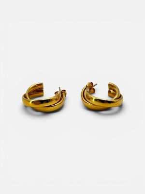 two pairs of gold hoop earrings on a white background