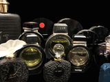a lot of perfume bottles that are sitting on a table