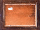 an old picture of a wooden frame with a sticker on it