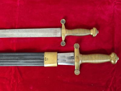 pair of two old swords on a red cloth with a red background